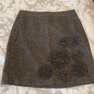 Women’s brown tweed skirt with flower appliqué